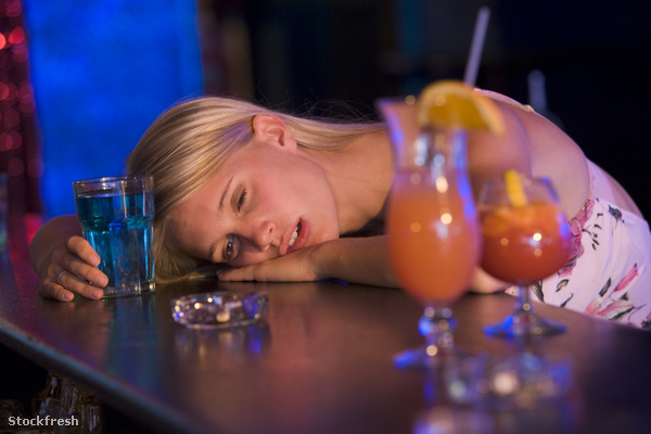 stockfresh 90769 drunk-young-woman-resting-head-on-bar-counter s