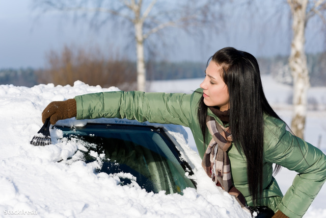 stockfresh 677964 winter-car---woman-remove-snow-from-windshield