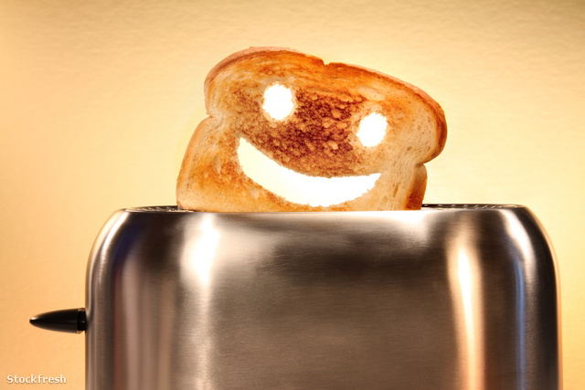 stockfresh 214564 toast-with-smiley-face-in-toaster-on-counter s