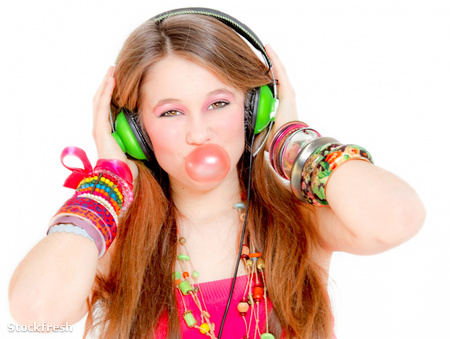 stockfresh 847598 funky-girl-listening-to-music-and-blowing-bubb