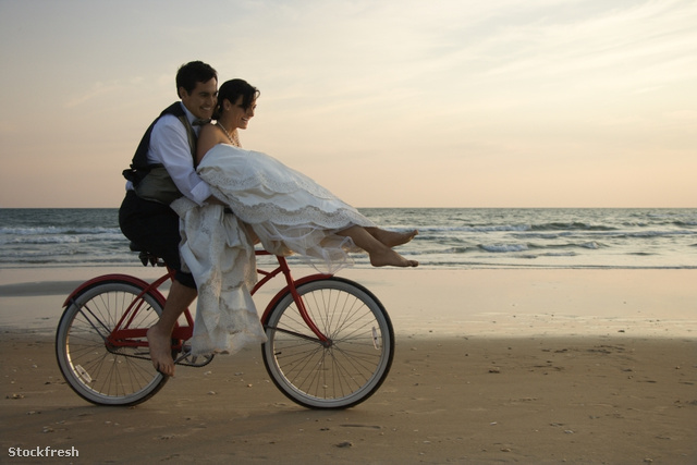 stockfresh 8810 couple-riding-bike-on-beach sizeS