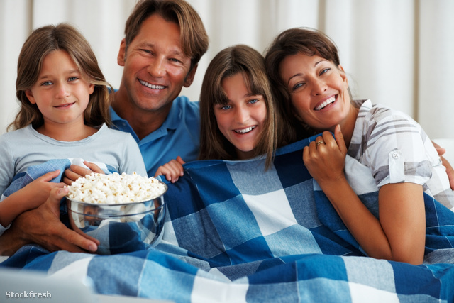 stockfresh 1195994 family-watching-a-movie-and-smiling sizeM