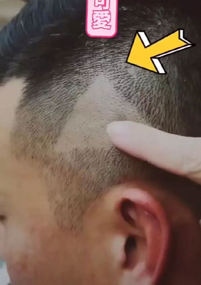 barber-cuts-triangle-mans-hair-showed-play-button-picture-3-5c34