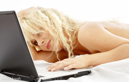 stockfresh 16013 portrait-of-blond-laying-in-bed-with-laptop siz