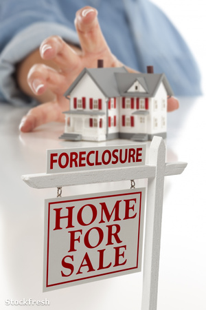 stockfresh 955517 foreclosure-sign-in-front-of-woman-reaching-fo