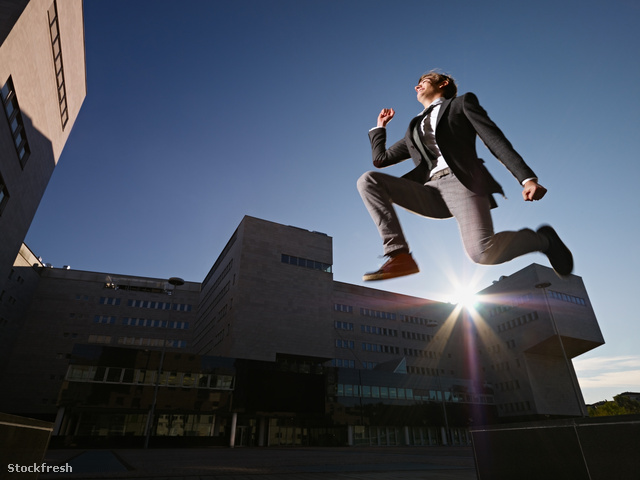 stockfresh 1602391 businessman-jumping-and-smiling-outside-offic