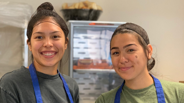 190603125019-01-leanne-carrasco-serves-pizza