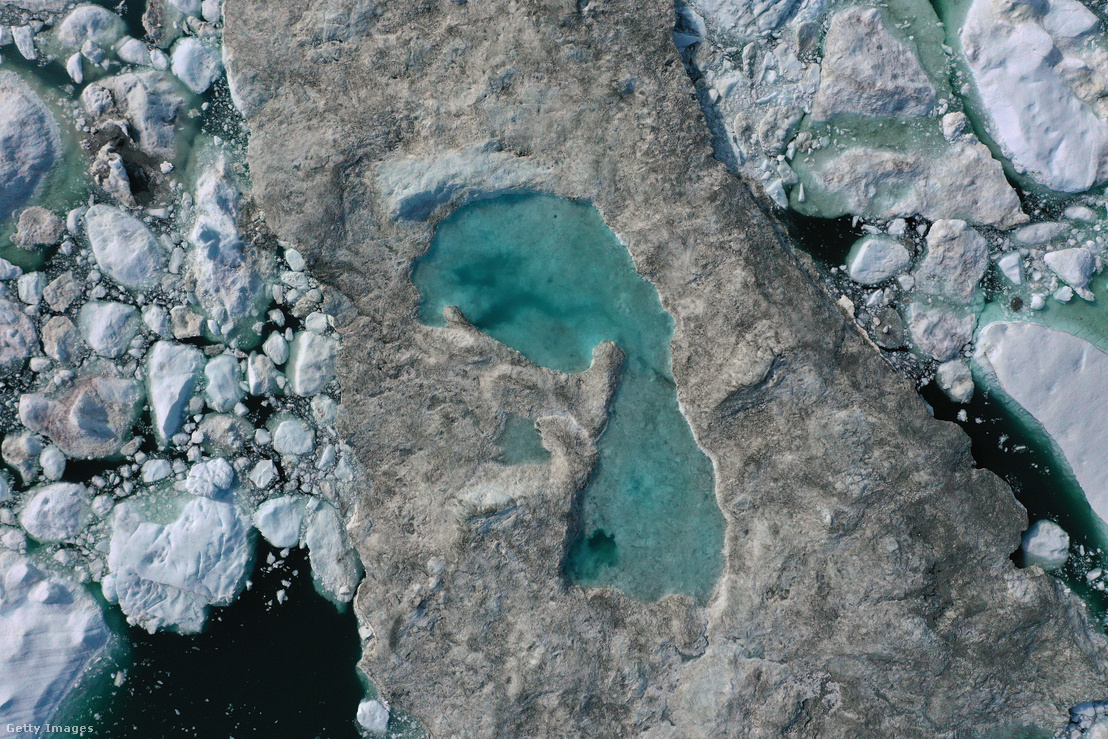 Ilulissat fyord, Greenland: Lake forming on top of an ice floe due to unusually high temperatures.