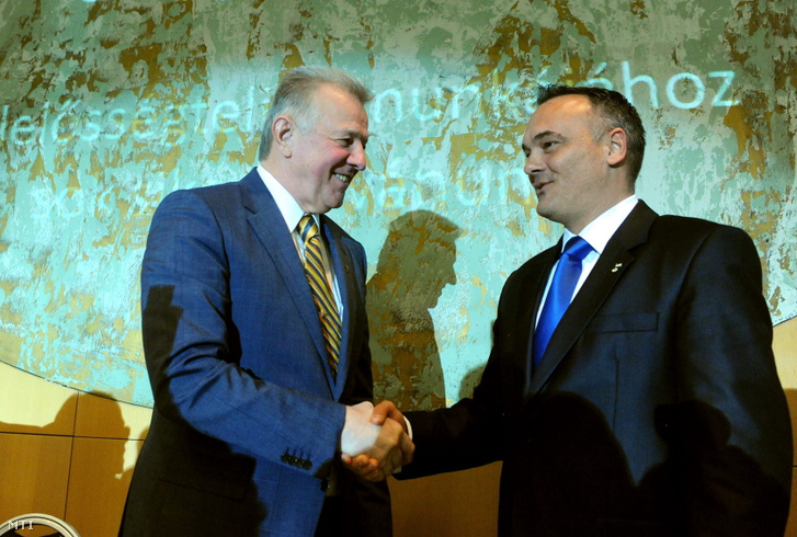 Pál Schmitt (l), then President of Hungary, congratulates Zsolt Borkai (r) for being elected as the president of the Hungarian Olympic Committee as the sole candidate.