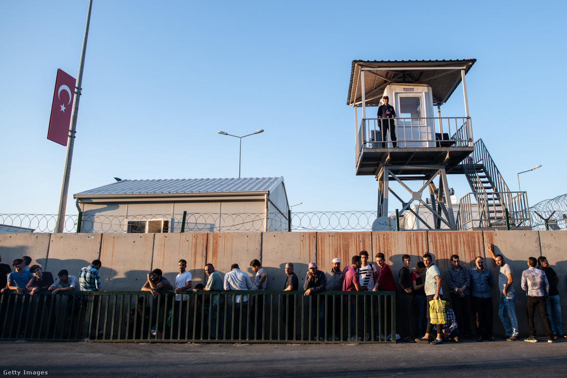 Syrian refugees wait in line to enter the Kahramanmaras refugee camp after returning from shopping on 19 September 2019 in Kahramanmaras, Turkey.