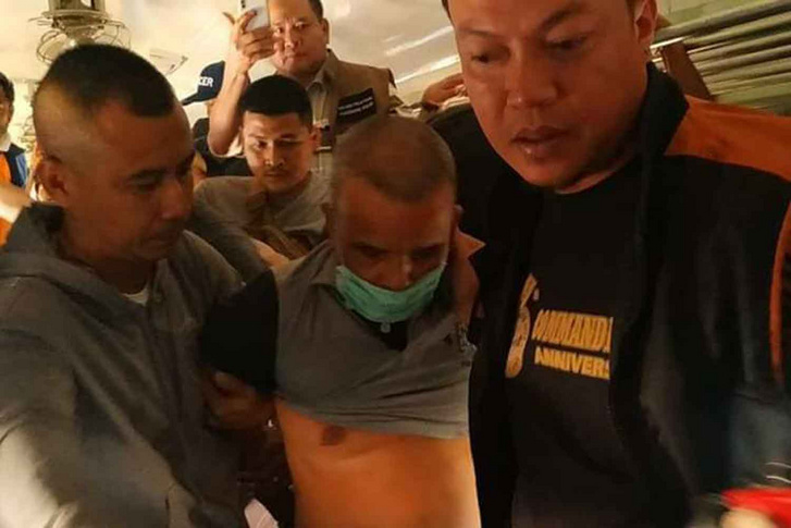 Somkid Phumphuang letartóztatása közben 2019. december 18-án.