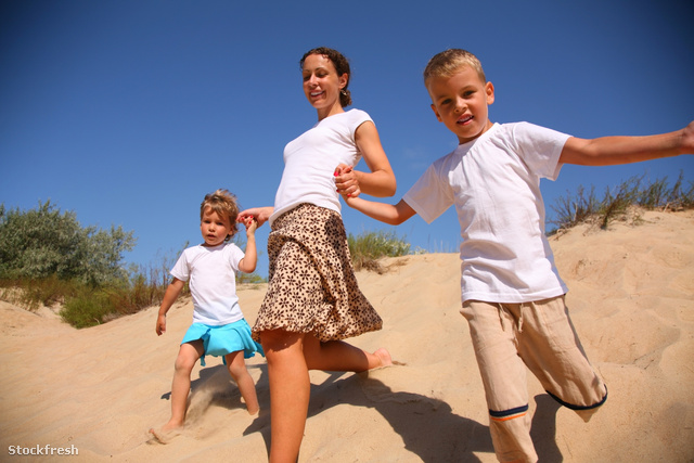 stockfresh 1207541 mother-with-children-runs-on-sand sizeM