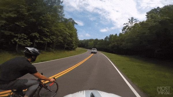 Car-hits-cyclist.gif