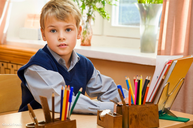 stockfresh 643222 young-schoolboy-sitting-behind-a-school-desk s