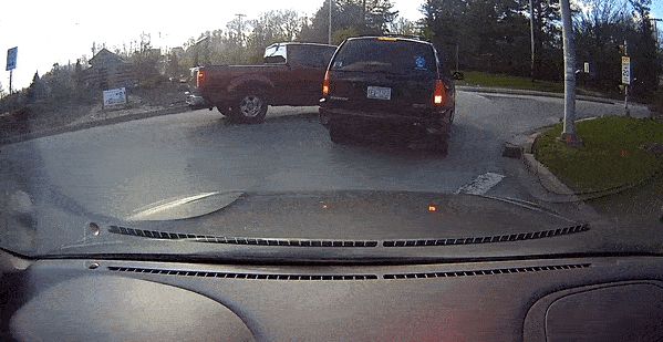 GMC-driver-hits-two-vehicles-in-roundabout.gif