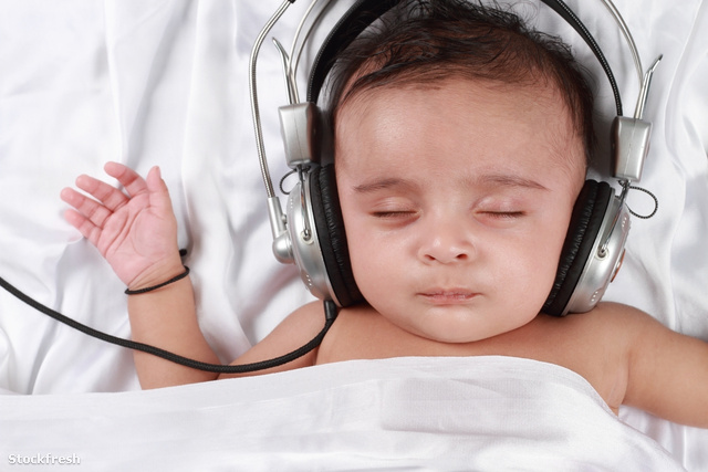 stockfresh 1769931 2-month-old-baby-listening-to-music-with-head