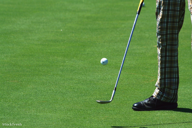 stockfresh 773253 golfer-juggling-a-golf-ball-with-retro-pants s