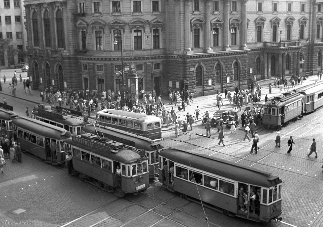 Budapest, July 6, 1954 Pedestrians walk on Blaha Lujza Square, at the intersection of József körút and Rákóczi út, in front of the National Theater.  Tram 6 on the Grand Boulevard in the foreground.