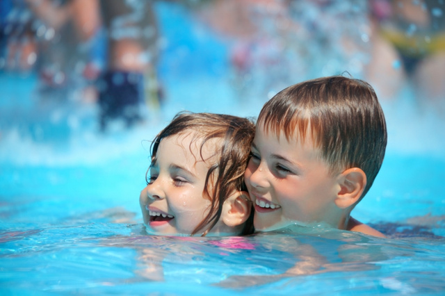 stockfresh id646009 smiling-boy-and-little-girl-swimming-in-pool