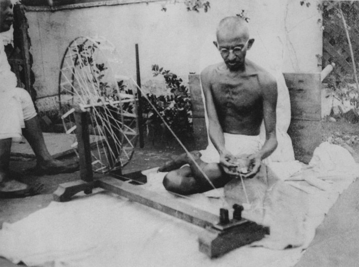 1450px-Gandhi spinning